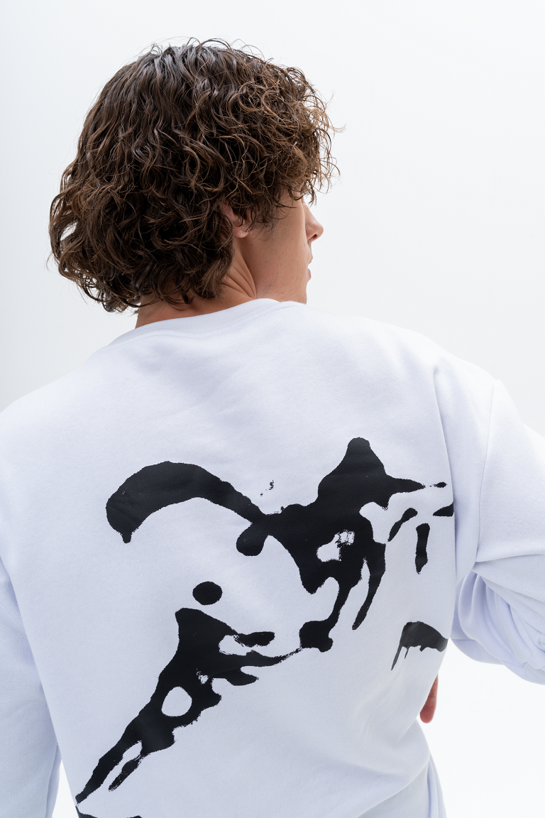 Bold demon print design on the front of the AKANTARA Round Neck Sweater