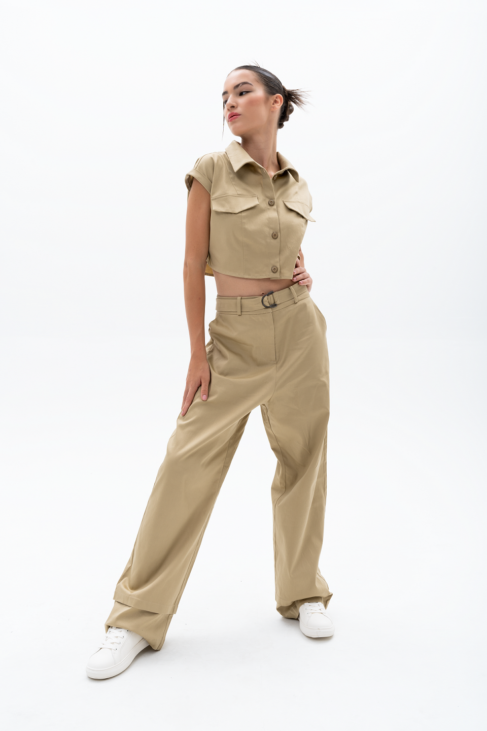 Model wearing AKANTARA Brown and Navy Pants, styled with the Cropped Short Sleeve Vest